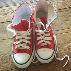Red canvas converse style sneakers.